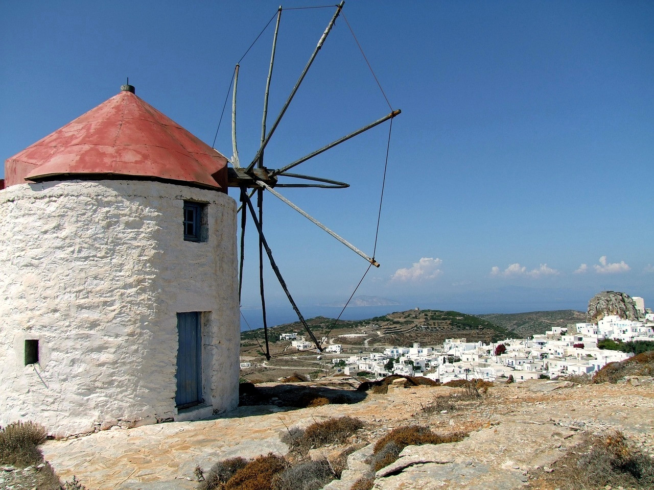 Traditional windmill above a white village - Cyclades - Greece