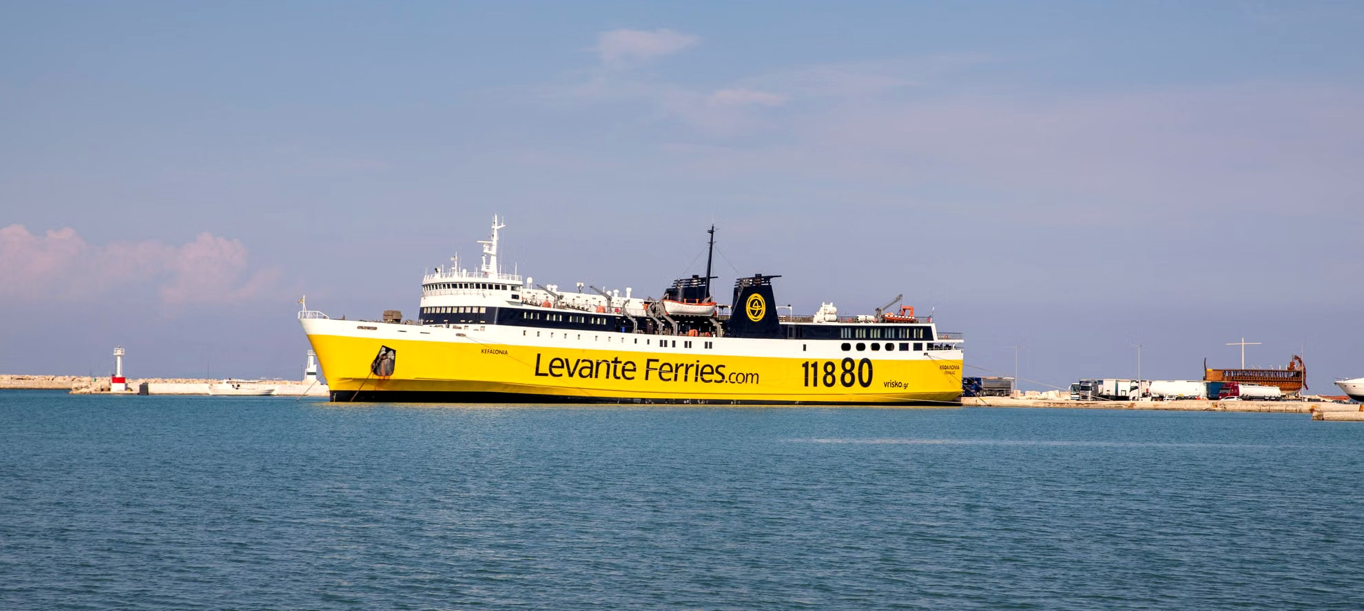Ferry alongside the quay in a Greek port before boarding - Greece