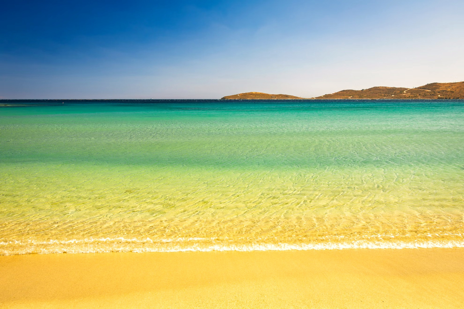 Beach with turquoise water under the summer sun - Greek Islands - Greece