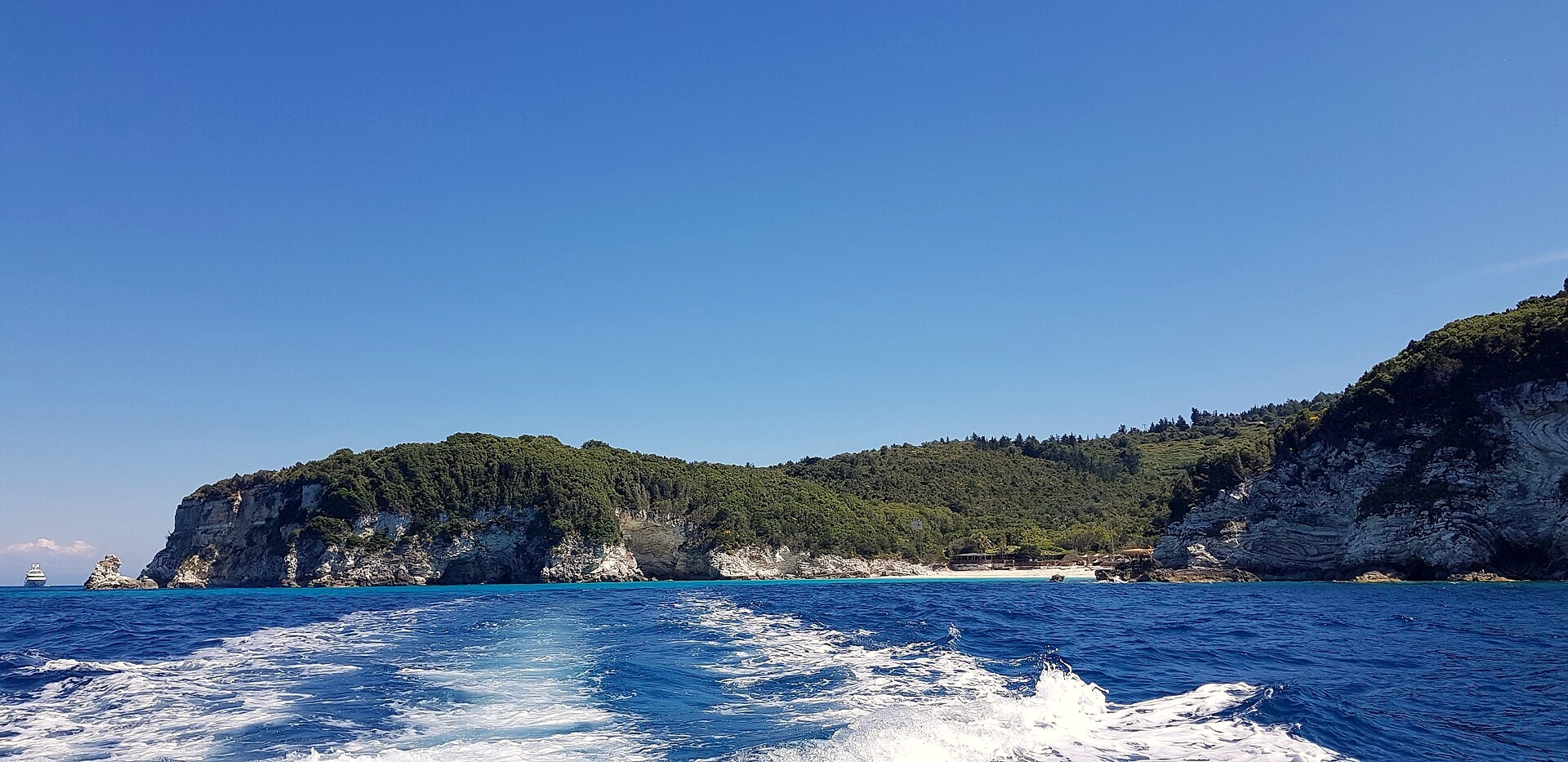 Green islet rising from the Ionian Sea seen from the boat - Ionian Islands - Greece