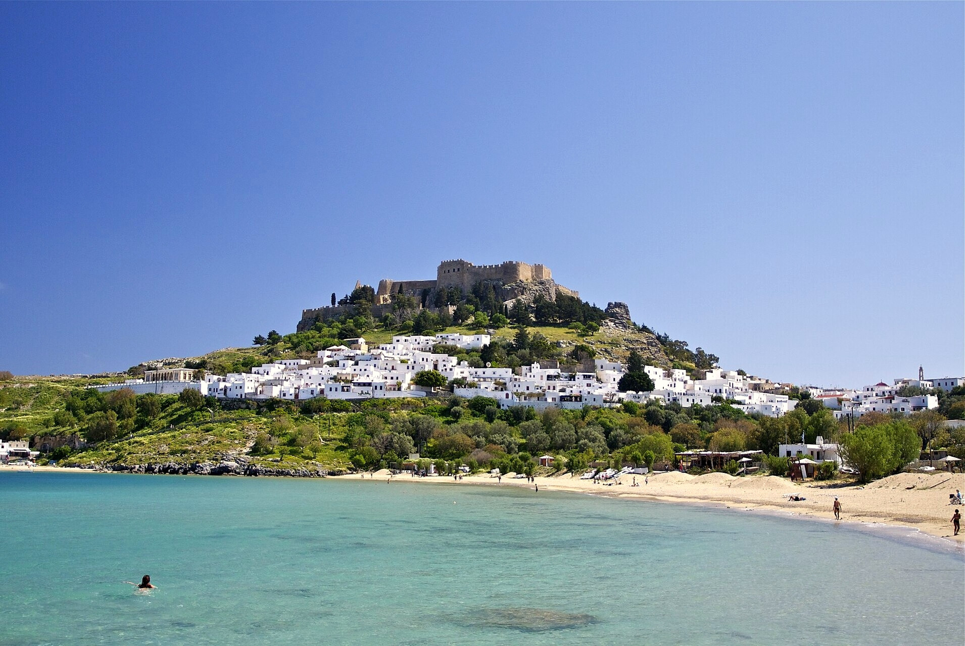 The acropolis of Lindos overlooking the white village and its bay - Rhodes, Dodecanese - Greece