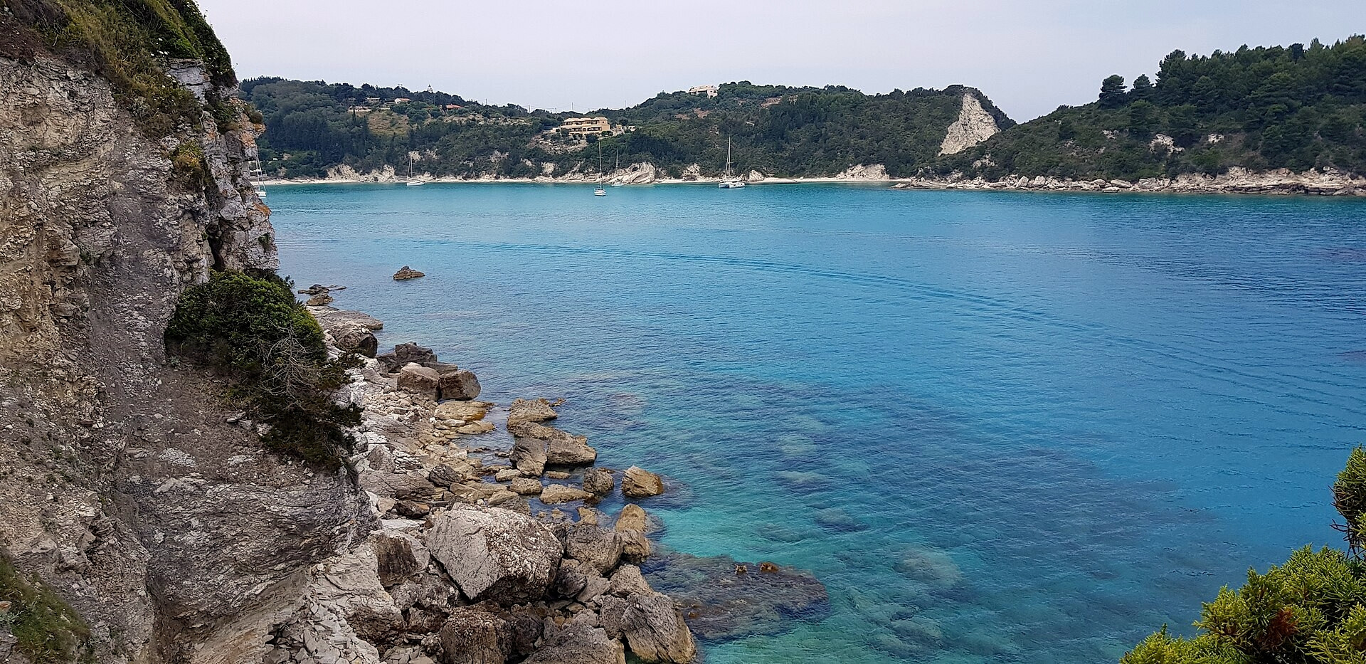 Cliffs and turquoise bay on the coast of Paxos - Ionian Islands - Greece