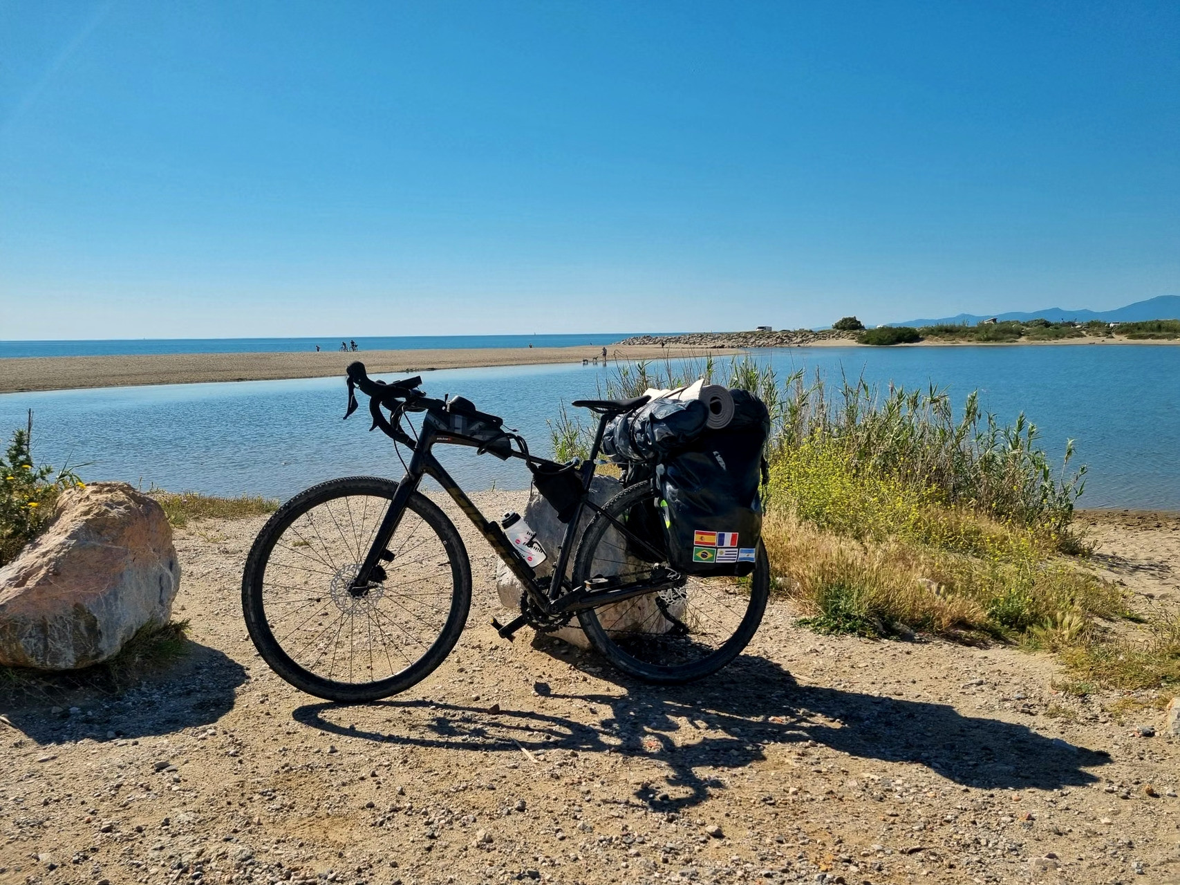 Loaded touring bike on a coastal road - Greece