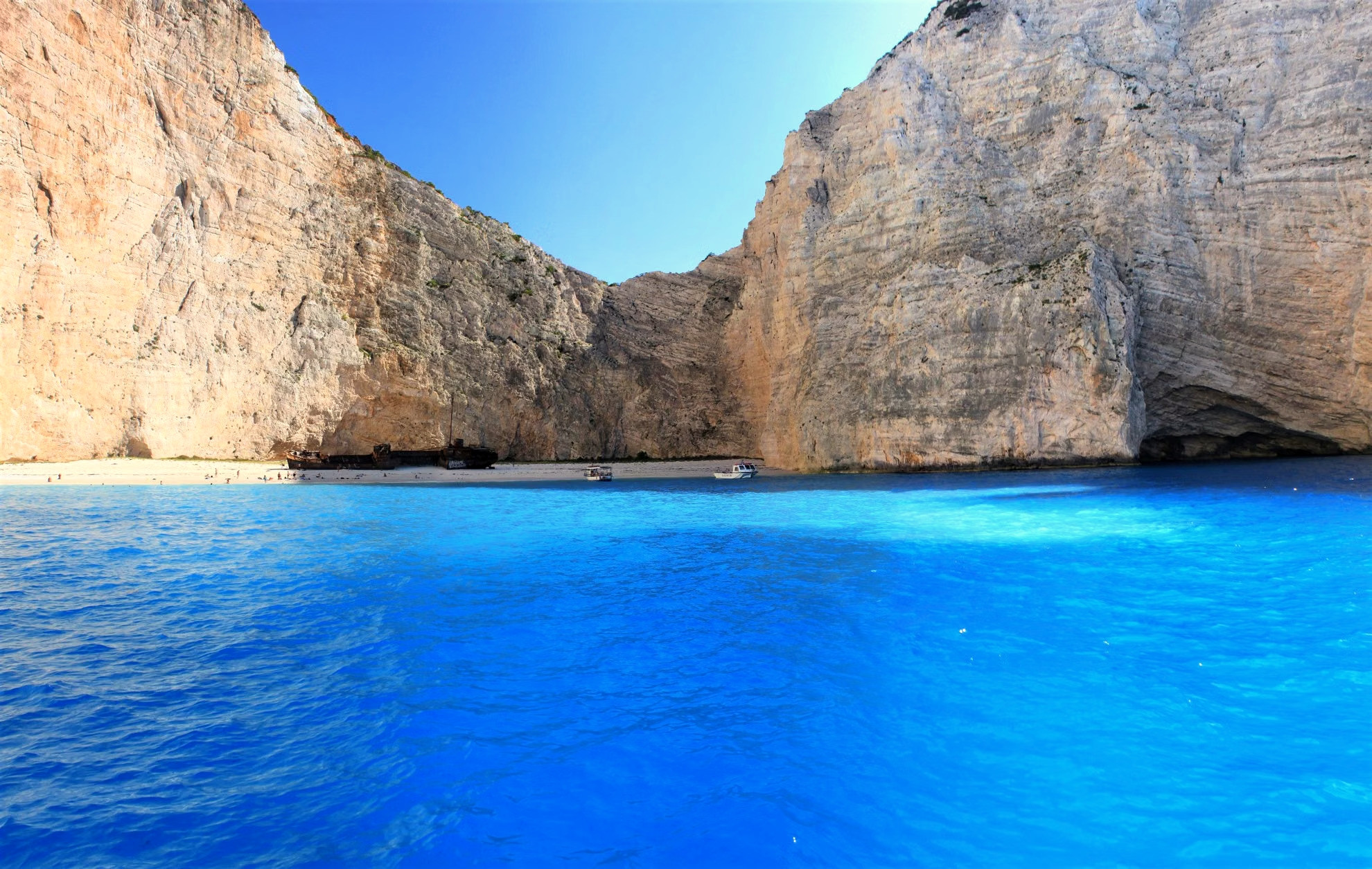 Cove with turquoise waters between white cliffs - Greece
